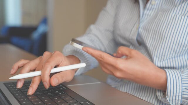 Business Professional using Smartphone, Laptop and Stylus for AI Workflow, SaaS Applications, CRM Management. Modern Digital Workplace with Productivity, Collaboration, Remote Work, Cloud Technology