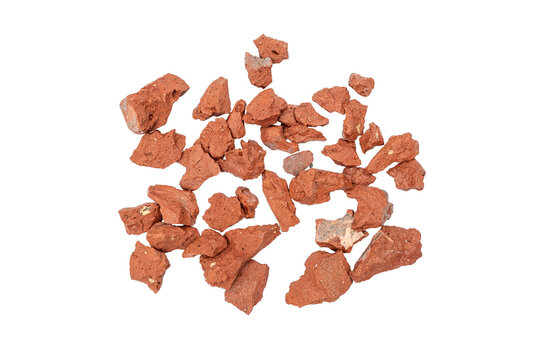 Scattered red brick rubble pieces isolated on a transparent background, showing broken construction material, rough texture, and demolition waste for building or renovation themes.