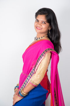 Happy young beautiful Indian woman in saree.