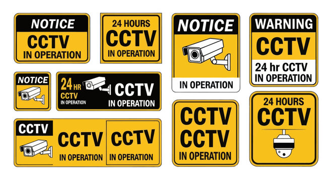 Multiple CCTV warning signs displayed together outdoors in daytime.