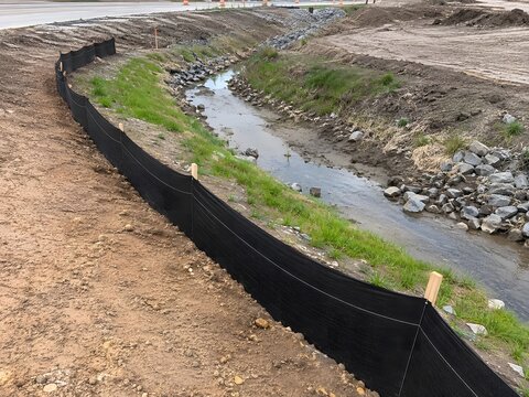 Silt Fence Protecting Drainage Ditch from Sediment Runoff

