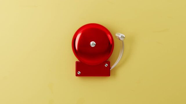 Red alarm bell on bright yellow background