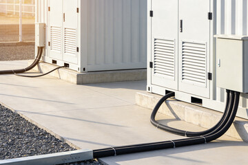 Industrial power units with electrical conduits on concrete pad © Snide12