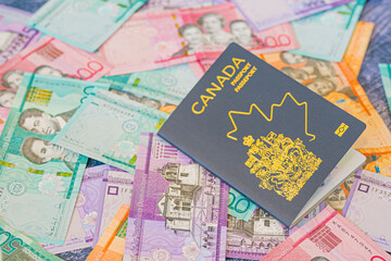 Naklejka premium Canadian Passport with Dominican Peso Notes