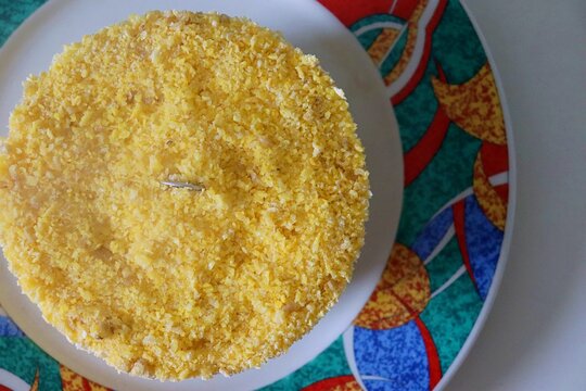 Traditional Brazilian couscous made of corn flour. Northeastern Brazilian breakfast (Cuscuz nordestino). 