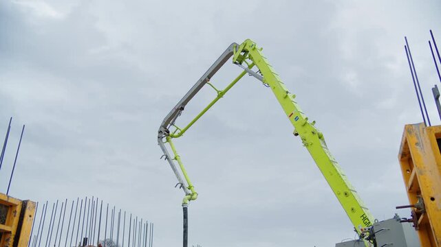 Concrete pump boom over construction formwork