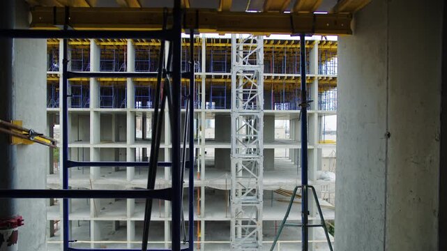 Scaffolding inside concrete building under construction
