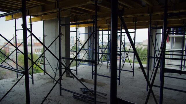 Scaffolding with city view inside unfinished building