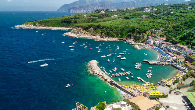 Drone view of Marina di Puolo seaside and crystal clear waters Italy