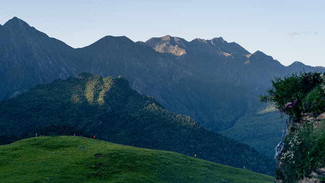Jiuding Mountain Meadow Distant Peak and Hikers