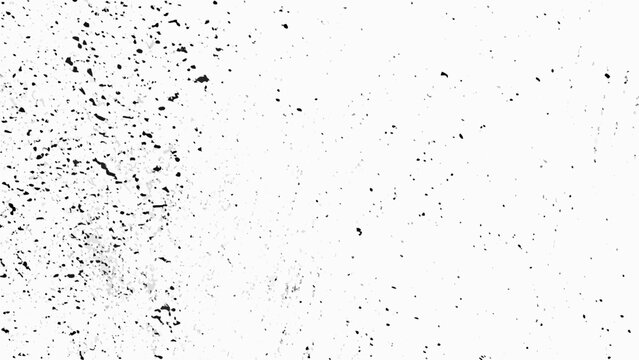 Distressed texture with scattered black speckles on a white background a grunge pattern for design abstract aging