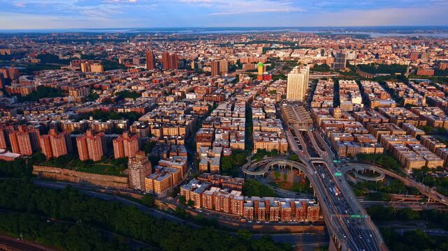 The Bronx, a borough of New York City at sunset. The prominent elevated highway system pictured is part of the Cross Bronx Expressway. Aerial view.