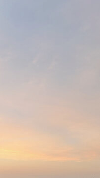 Warm pastel sunset sky background with copy space