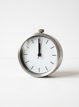 Simple clock face showing 12 o'clock on white background