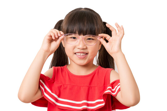 Asian school girl wearing eyeglasses, vision care and eyesight concept, child adjusting glasses portrait isolated on white background