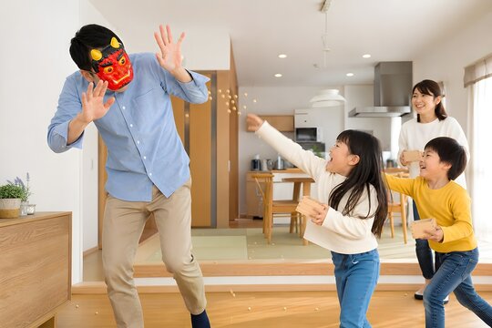 節分で豆まきをする楽しい家族