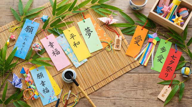 Creative flat lay composition of Tanabata festival elements including tanzaku wish papers