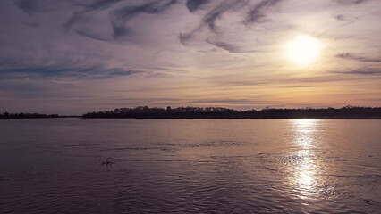 Obraz premium sunset over the river
