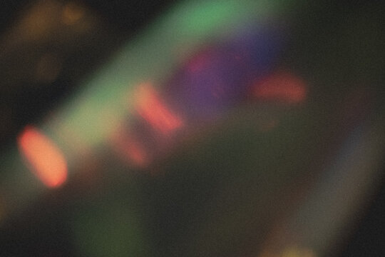 light leak overlay effect with dust and blur colorful light leaks,retro noisy film texture light leak flare on black background,abstract background with colorful light,grunge old film burn
