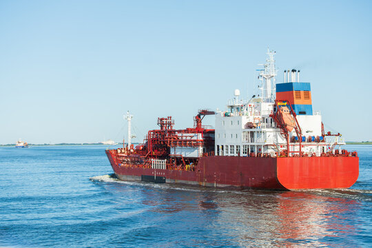 Large Industrial Liquefied Natural Gas Tanker Vessel Cruising on River, The Concept of Global Trade