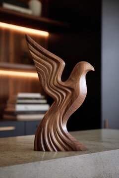 Abstract wooden bird carving on stone surface.
