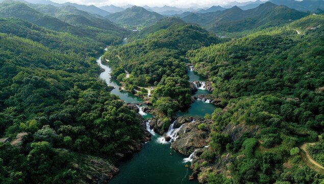 Aerial vista of a meandering river and mountains.