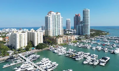 Fototapeten Pony Aerial view of Miami Beach with marina, yachts and coastal. Miami Beach coastal skyline with boats. Miami Beach cityscape with marina port. Coastal cityscape of Miami Beach with yachts and harbor.  © Volodymyr