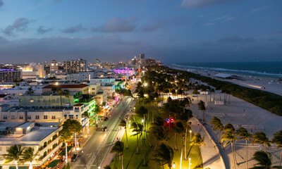 Obraz premium Summer vacation on Miami at night. Night travel in Miami beach, nightlife in tropical American city. Miami city at evening. Miami shoreline.