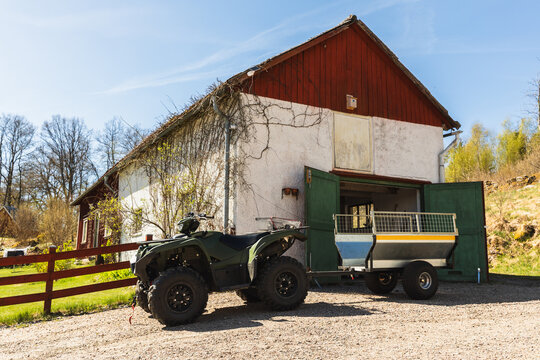 Green ATV with Trailer on Farm
