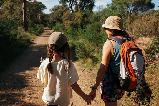 Grandmother and child Walk Along Mediterranean landscape