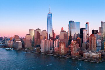 Obraz premium New York waterfront panorama with buildings. New York skyline near downtown. New York City harbor with NYC. New York skyscrapers in Lower Manhattan.