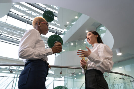 Multiracial businesswomen talking during break