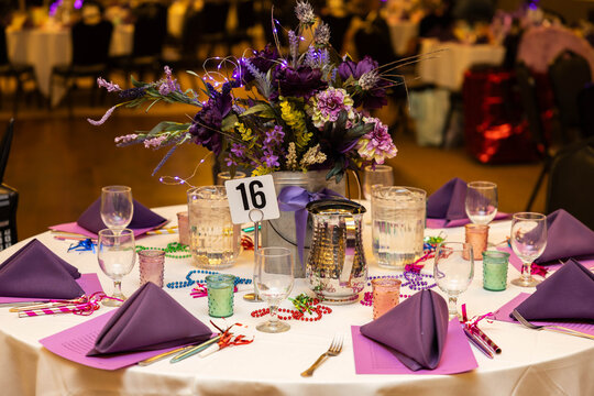 Elegant Purple Floral Centerpiece on Decorated Banquet Table at Formal Event