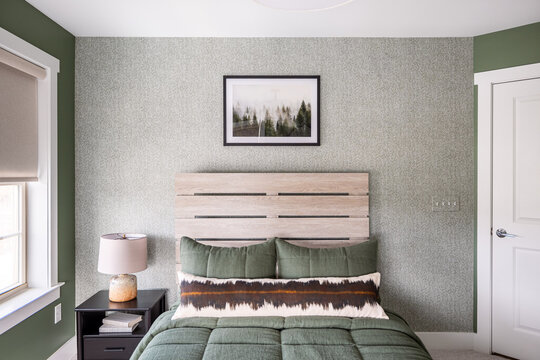Cozy Modern Green Bedroom with Wooden Slat Headboard and Textured Accent Wall