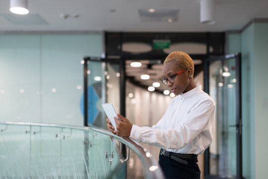 Black businesswoman browsing digital tablet