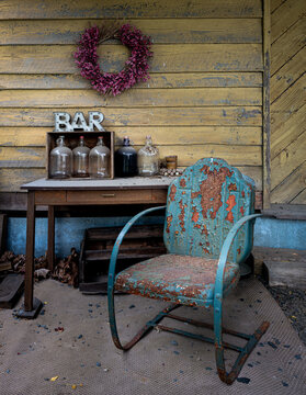 Display of vintage items behind an old building at the long-abandoned railroad depot of Cohasset, Virginia.