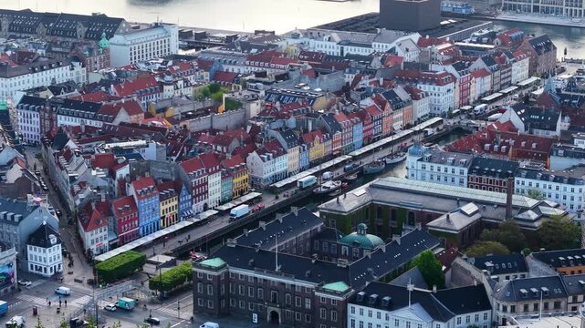 Drone shot of Nyhavn canal waterfront townhouses in Copenhagen city, Denmark