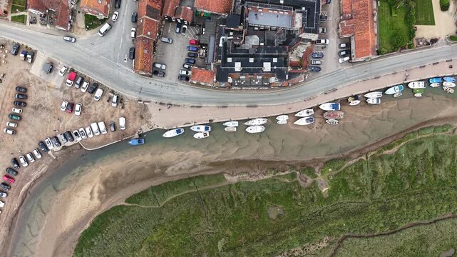 Top-down view of Blakeney quayside marina boats and waterfront, United Kingdom