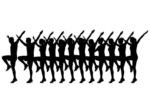 Silhouettes of people in an aerobics class performing a coordinated movement