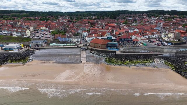 Drone shot of coastline and beach in Sheringham town, Norfolk, United Kingdom