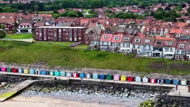 Drone shot of beach huts along Sheringham coastline,, Norfolk, United Kingdom