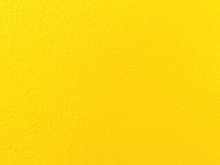 Fototapeta premium Yellow wall texture background bright vibrant color surface empty space for design minimalist backdrop concrete wall material