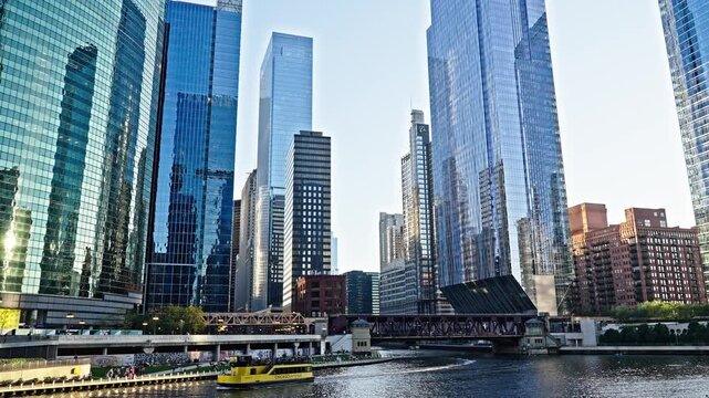 Chicago, USA - October 23, 2024: Cityscape view with water taxi. City boat tour. Chicago city travel. Skyscraper building at business district. Skyscraper of Chicago downtown