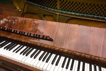 Old retro piano, musical instruments, vintage piano outdoors. Musical background. © Iva Noel