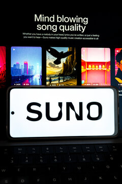 Suno ai music creation app on smartphone keyboard