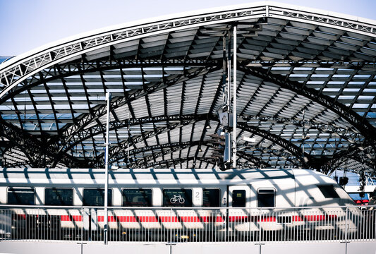 K&ouml;ln, Germany: white intercity train passing main train station 