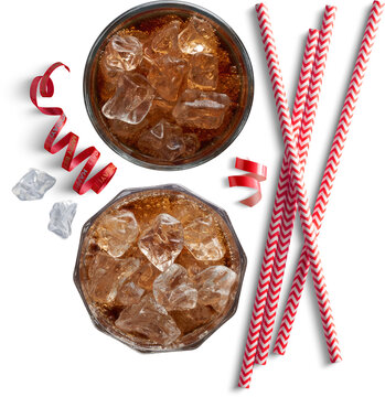 Two glasses of cola with ice cubes and straws top view isolated on transparent background