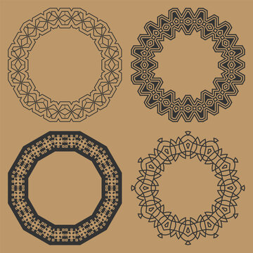 Four round monochrome frames with openwork contour ornaments in various artistic styles. Vector set