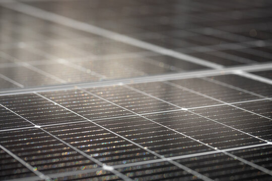 Close-Up of Solar Panel Cells with Light Reflection
