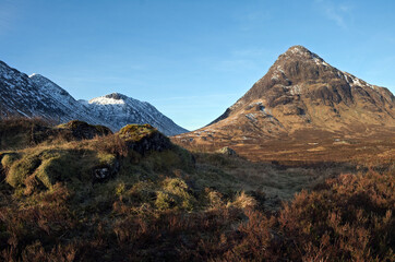 Stob Dearg, the principal peak of Buachaille Etive Mor and some of the Glen Etive hills, in spring sunshine. Seen from Rannoch Moor just off the A82 road. Glencoe, Lochaber, Scottish Highlends. © David